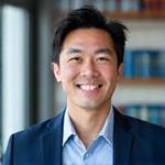 Portrait of Dr. Robert Kim, a distinguished sleep medicine specialist, smiling confidently.